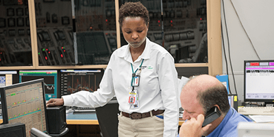 Image of co-workers inside Callaway Energy Center control room. 