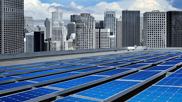 solar panels with skyscrapers in the background. 