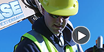 Close up of contractor digging with arrow.